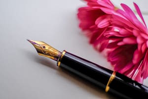 black and gold-colored fountain pen beside flower