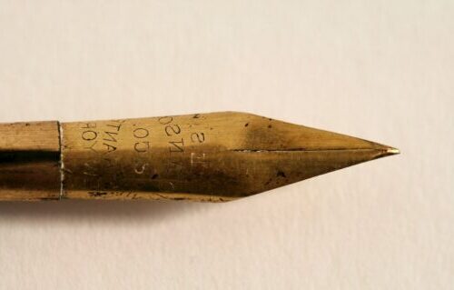 closeup photo of gold fountain pen