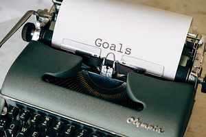 black and white typewriter on green textile
