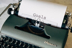 black and white typewriter on green textile
