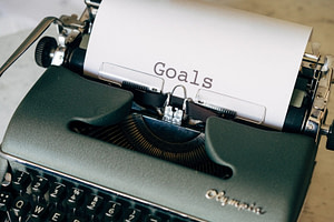 black and white typewriter on green textile