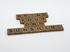 brown wooden puzzle piece on white surface