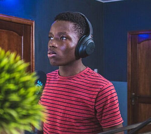 man in red and black striped crew neck shirt wearing headphones