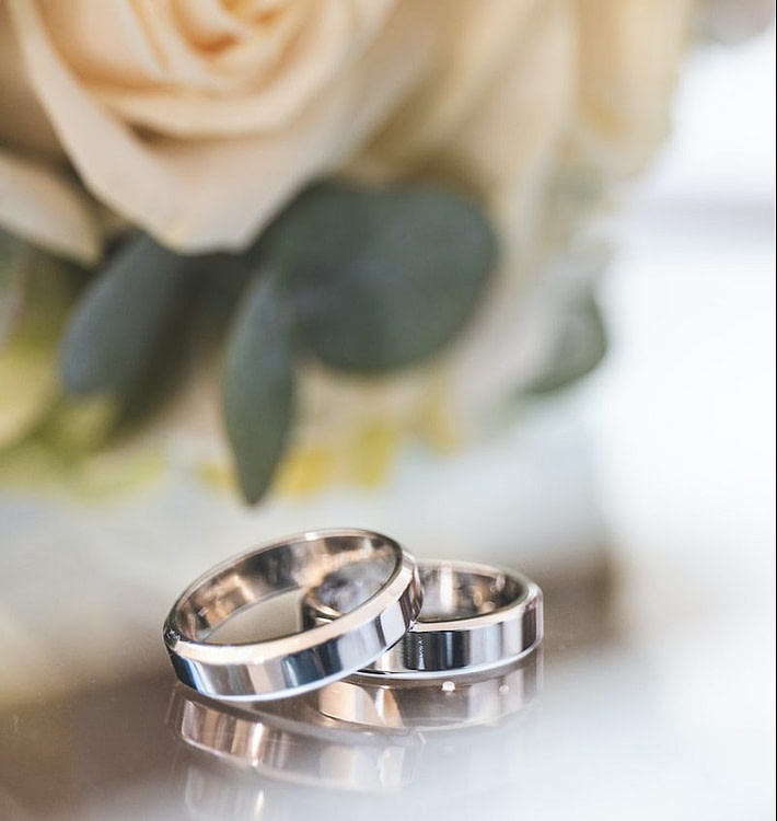 silver-colored wedding bands