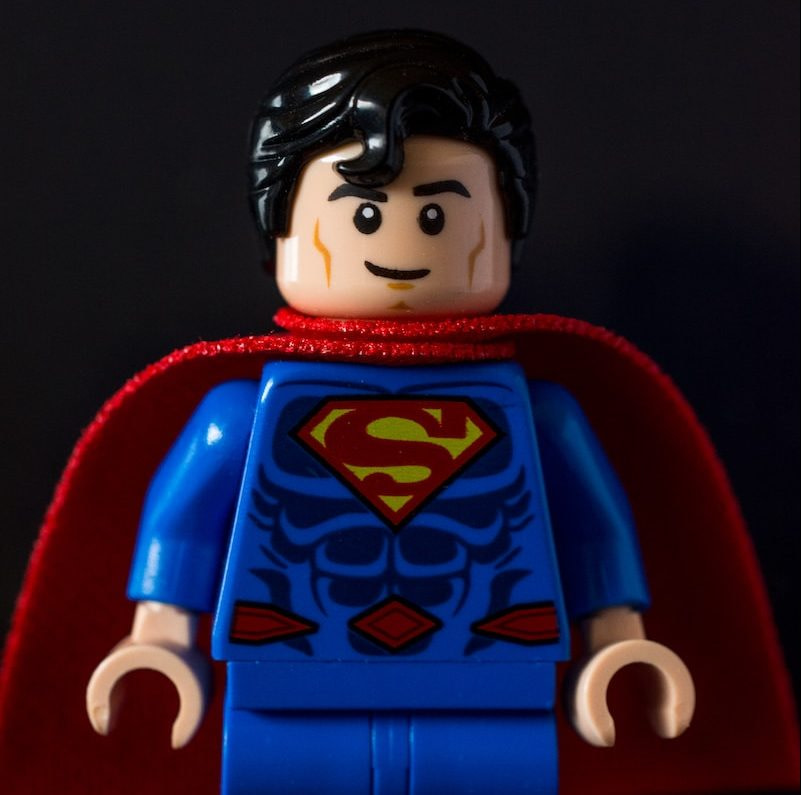 lego mini figure on red chair
