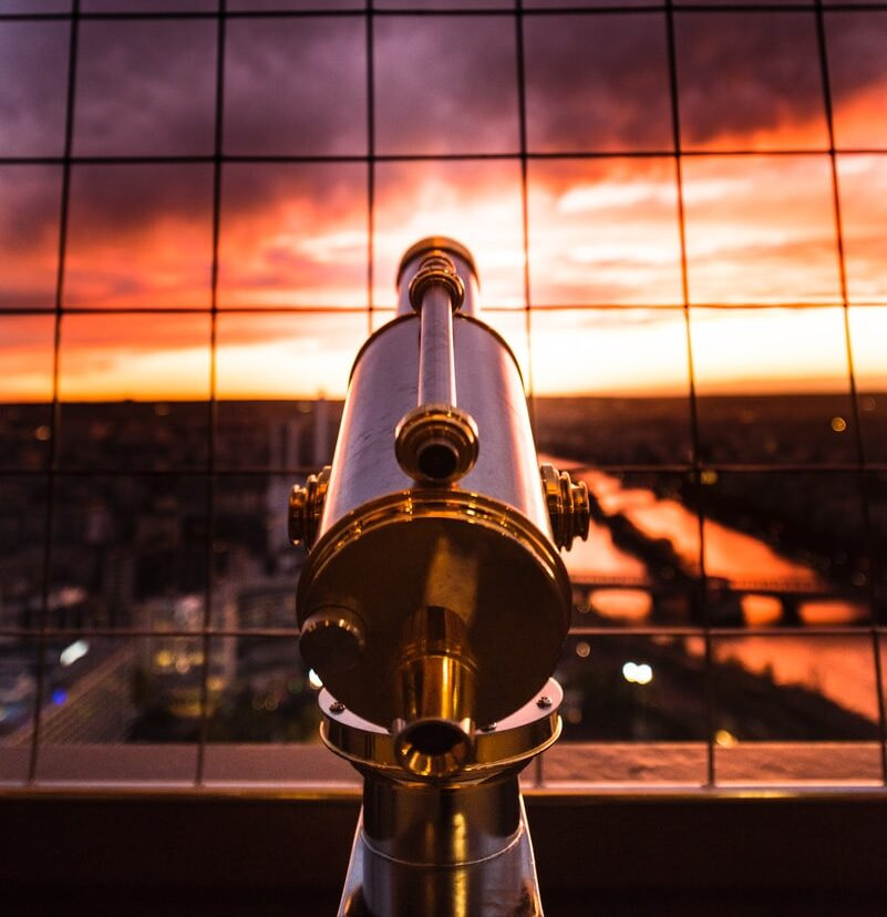 gray and yellow telescope against grill