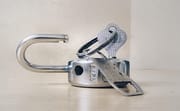 Photo by Basil James gray stainless steel padlock