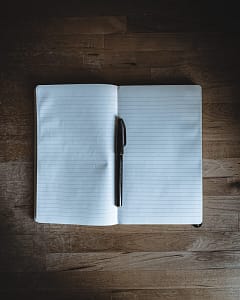 black click pen on white notebook