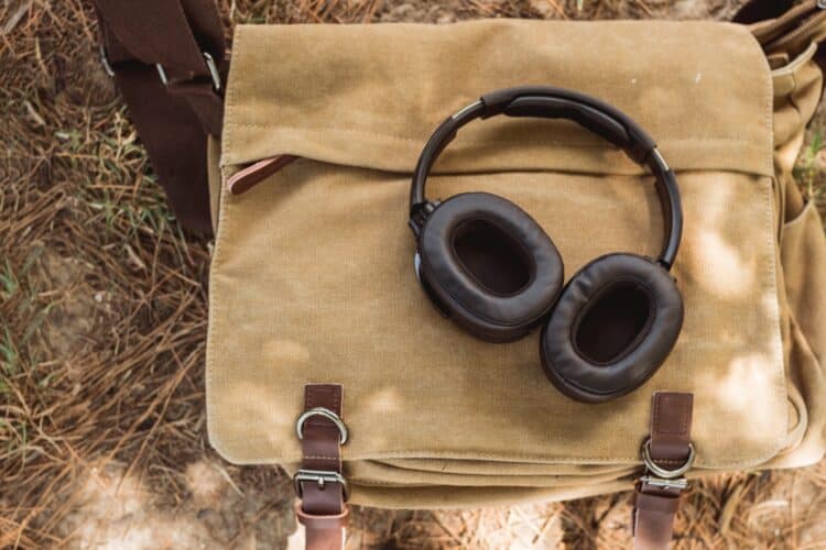 wireless headphones on shoulder bag