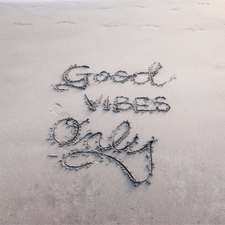 Good Vibes Only sand text